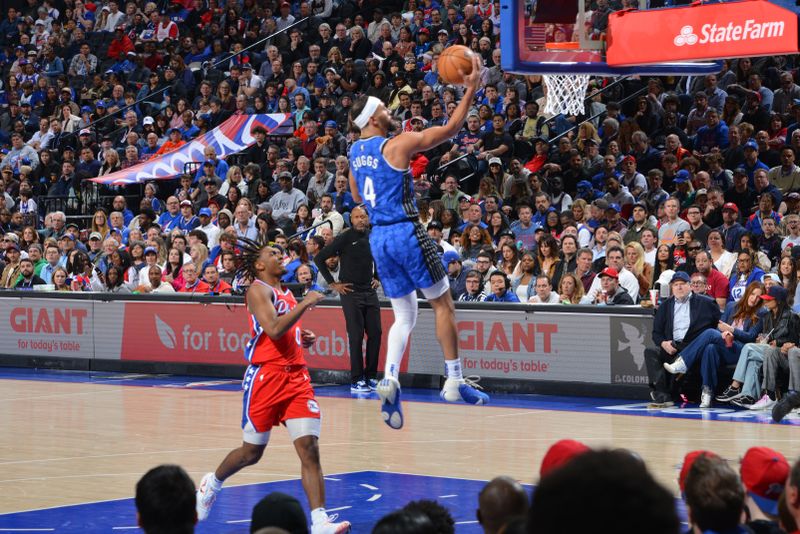 PHILADELPHIA, PA - APRIL 12: Jalen Suggs #4 of the Orlando Magic drives to the basket during the game against the Philadelphia 76ers on April 12, 2024 at the Wells Fargo Center in Philadelphia, Pennsylvania NOTE TO USER: User expressly acknowledges and agrees that, by downloading and/or using this Photograph, user is consenting to the terms and conditions of the Getty Images License Agreement. Mandatory Copyright Notice: Copyright 2024 NBAE (Photo by Jesse D. Garrabrant/NBAE via Getty Images)