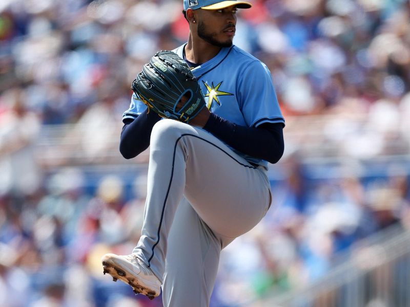 Mar 20, 2025; Dunedin, Florida, USA; Tampa Bay Rays pitcher Taj Bradley (45) throws a pitch against the Toronto Blue Jays in the first inning during spring training at TD Ballpark. Mandatory Credit: Nathan Ray Seebeck-Imagn Images