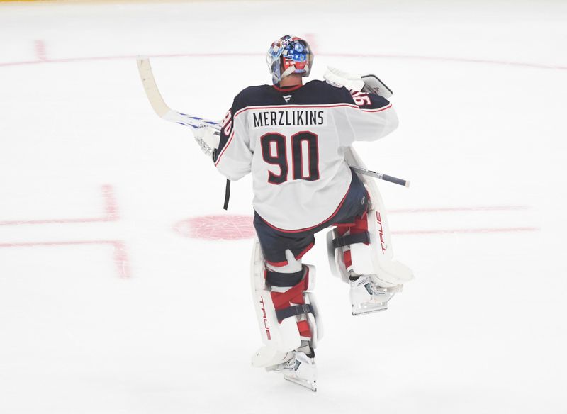 Oct 25, 2025; Pittsburgh, Pennsylvania, USA; Columbus Blue Jackets goalie Elvis Merzlikins (90) celebrates a win over the  Pittsburgh Penguins after a shoot-out at PPG Paints Arena. The Blue Jackets won 5-4. Mandatory Credit: Philip G. Pavely-Imagn Images
