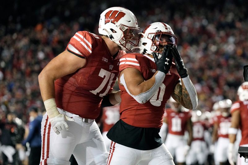 Nov 18, 2023; Madison, Wisconsin, USA;  Wisconsin Badgers running back Braelon Allen (0) celebrates after scoring a touchdown during overtime against the Nebraska Cornhuskers at Camp Randall Stadium. Mandatory Credit: Jeff Hanisch-USA TODAY Sports