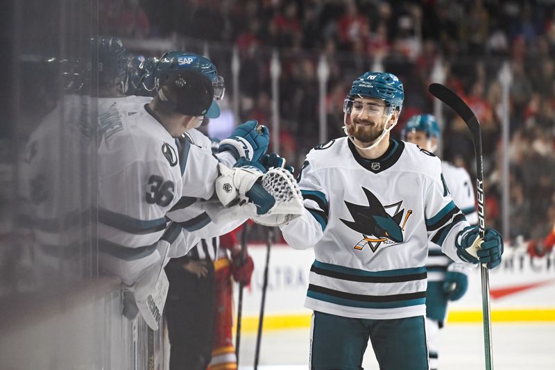 Feb 15, 2024; Calgary, Alberta, CAN; San Jose Sharks right wing Filip Zadina (18) celebrates a goal against the Calgary Flames with teammates during the third period at Scotiabank Saddledome. Mandatory Credit: Brett Holmes-USA TODAY Sports