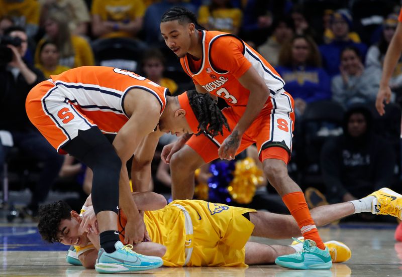 Jan 16, 2024; Pittsburgh, Pennsylvania, USA; Pittsburgh Panthers forward Guillermo Diaz Graham (bottom) fights for a loose ball with Syracuse Orange forward Benny Williams (13) and guard Judah Mintz (3) during the second half at the Petersen Events Center. Syracuse won 69-58. Mandatory Credit: Charles LeClaire-USA TODAY Sports