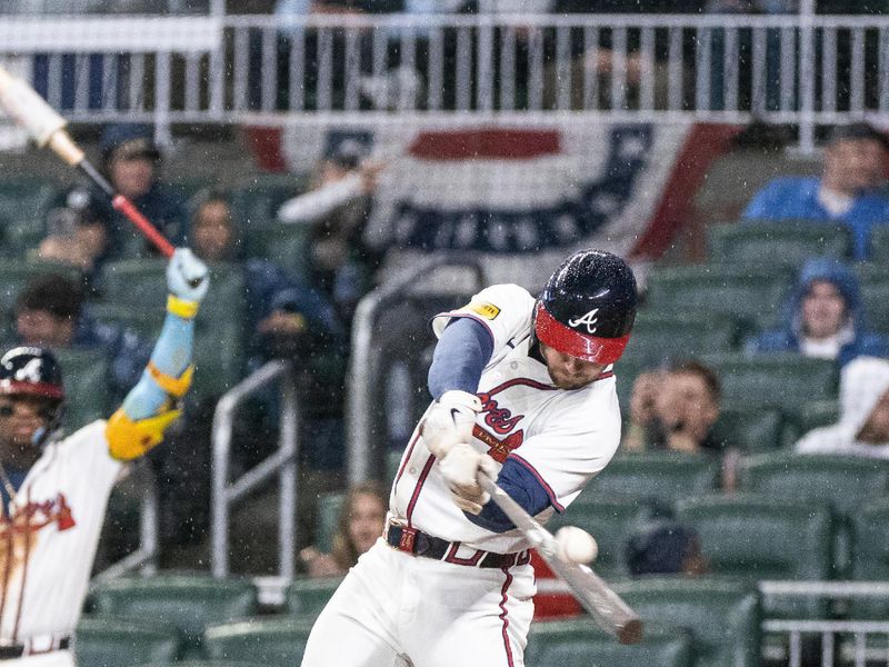 Apr 9, 2024; Cumberland, Georgia, USA; Atlanta Braves outfielder Jarred Kelenic (24) makes contact for a foul ball against New York Mets during the fifth inning at Truist Park. Mandatory Credit: Jordan Godfree-USA TODAY Sports