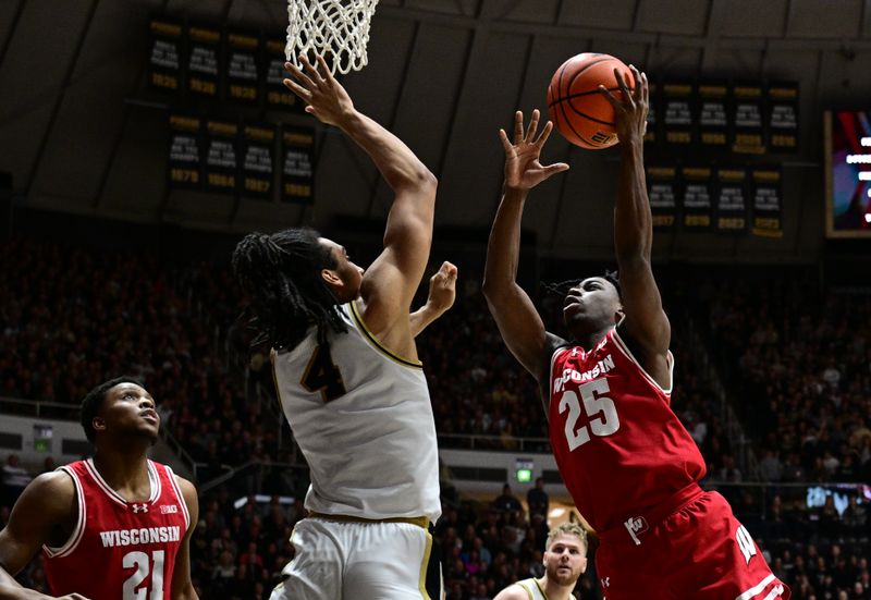 Mar 10, 2024; West Lafayette, Indiana, USA;  Wisconsin Badgers guard John Blackwell (25) shoots the ball over Purdue Boilermakers forward Trey Kaufman-Renn (4) during the first half at Mackey Arena. Mandatory Credit: Marc Lebryk-USA TODAY Sports