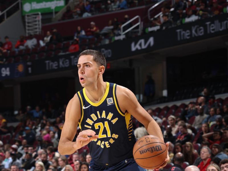 Cleveland, OH - OCTOBER 10: Cole Swider #21 of the Indiana Pacers dribbles the ball during the game against the Cleveland Cavaliers during a NBA pre season game on October 10, 2024 at Rocket Mortgage Fieldhouse in Cleveland, Ohio. NOTE TO USER: User expressly acknowledges and agrees that, by downloading and or using this photograph, User is consenting to the terms and conditions of the Getty Images License Agreement. Mandatory Copyright Notice: Copyright 2024 NBAE (Photo by Jeff Haynes/NBAE via Getty Images)