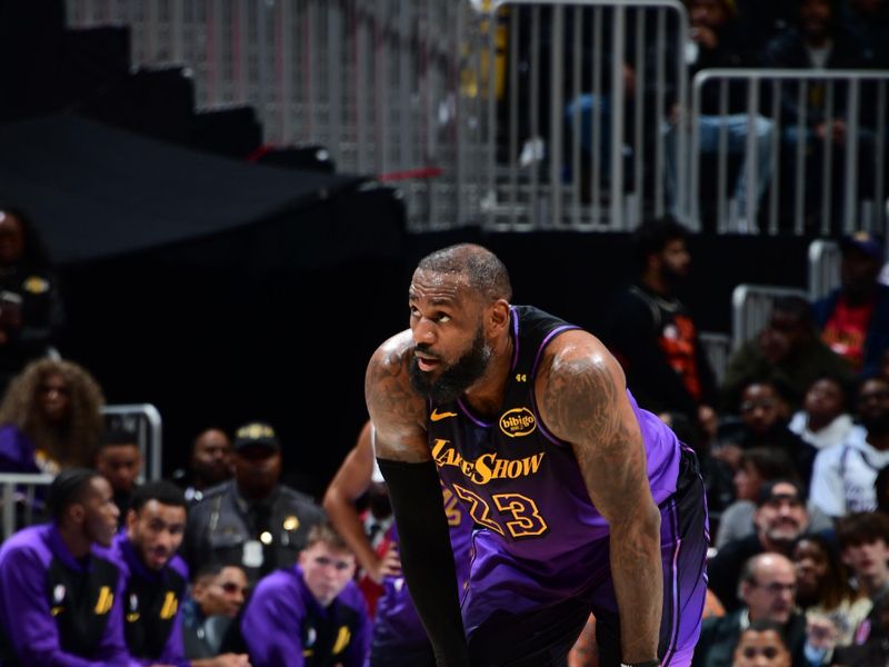 ATLANTA, GA - DECEMBER 6: LeBron James #23 of the Los Angeles Lakers looks on during the game against the Atlanta Hawks on December 6, 2024 at State Farm Arena in Atlanta, Georgia.  NOTE TO USER: User expressly acknowledges and agrees that, by downloading and/or using this Photograph, user is consenting to the terms and conditions of the Getty Images License Agreement. Mandatory Copyright Notice: Copyright 2024 NBAE (Photo by Scott Cunningham/NBAE via Getty Images)