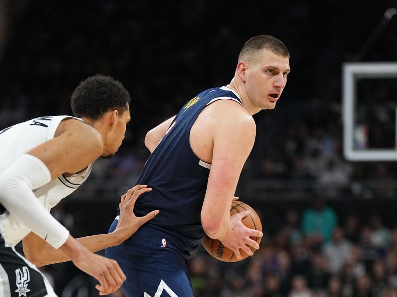 AUSTIN, TX - MARCH 15: Nikola Jokic #15 of the Denver Nuggets handles the ball during the game against the San Antonio Spurs on March 15, 2024 at the Moody Center in Austin, Texas. NOTE TO USER: User expressly acknowledges and agrees that, by downloading and/or using this Photograph, user is consenting to the terms and conditions of the Getty Images License Agreement. Mandatory Copyright Notice: Copyright 2024 NBAE (Photo by Garrett Ellwood/NBAE via Getty Images)