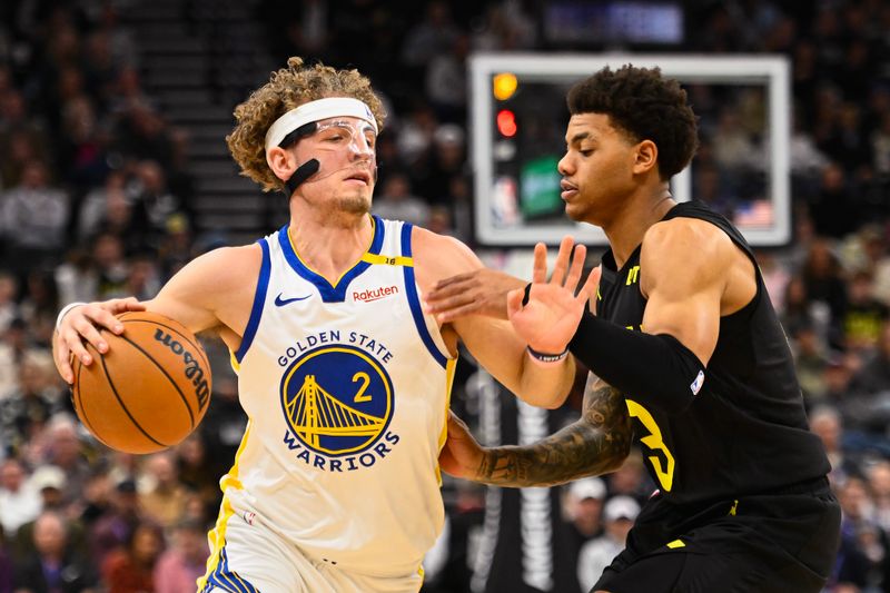 SALT LAKE CITY, UTAH - OCTOBER 25: Brandin Podziemski #2 of the Golden State Warriors drives into Keyonte George #3 of the Utah Jazz during the second half of a game at Delta Center on October 25, 2024 in Salt Lake City, Utah. NOTE TO USER: User expressly acknowledges and agrees that, by downloading and or using this photograph, User is consenting to the terms and conditions of the Getty Images License Agreement. (Photo by Alex Goodlett/Getty Images)