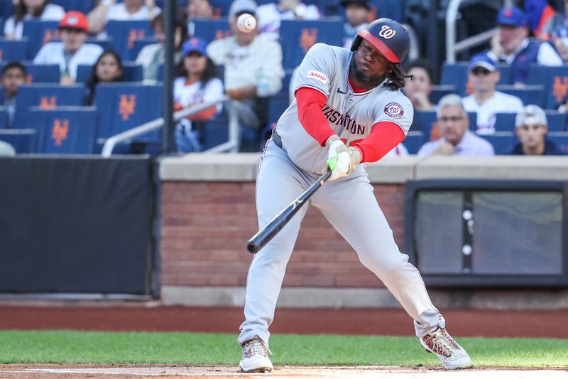 Sep 20, 2025; New York City, New York, USA; Washington Nationals first baseman Josh Bell (19) hits a single in the first inning against the New York Mets at Citi Field. Mandatory Credit: Wendell Cruz-Imagn Images
