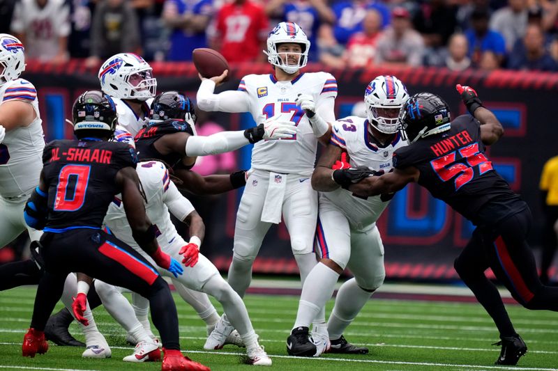 Buffalo Bills quarterback Josh Allen (17) throws a pass during the first half of an NFL football game against the Houston Texans, Sunday, Oct. 6, 2024, in Houston. (AP Photo/Eric Christian Smith)