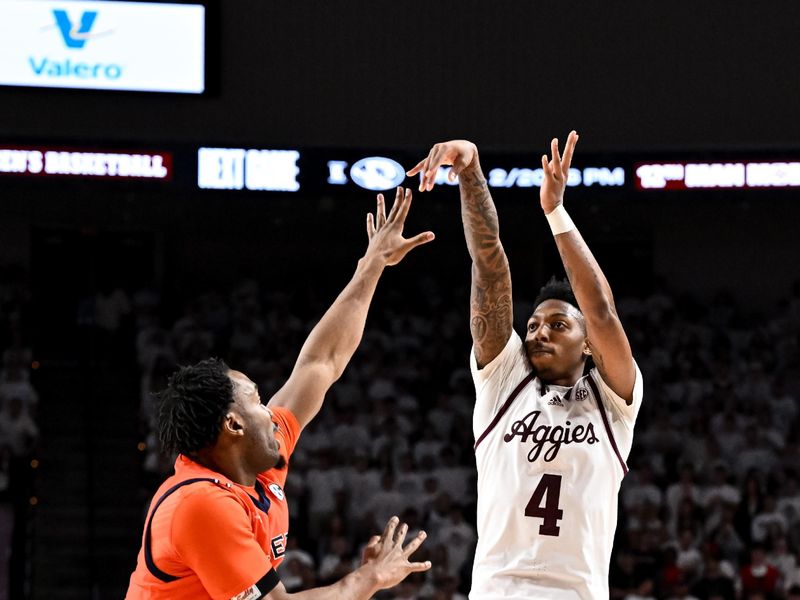 Feb 7, 2023; College Station, Texas, USA; Texas A&M Aggies guard Wade Taylor IV (4) shoots over Auburn Tigers forward Chris Moore (5) during the second half at Reed Arena. Mandatory Credit: Maria Lysaker-USA TODAY Sports