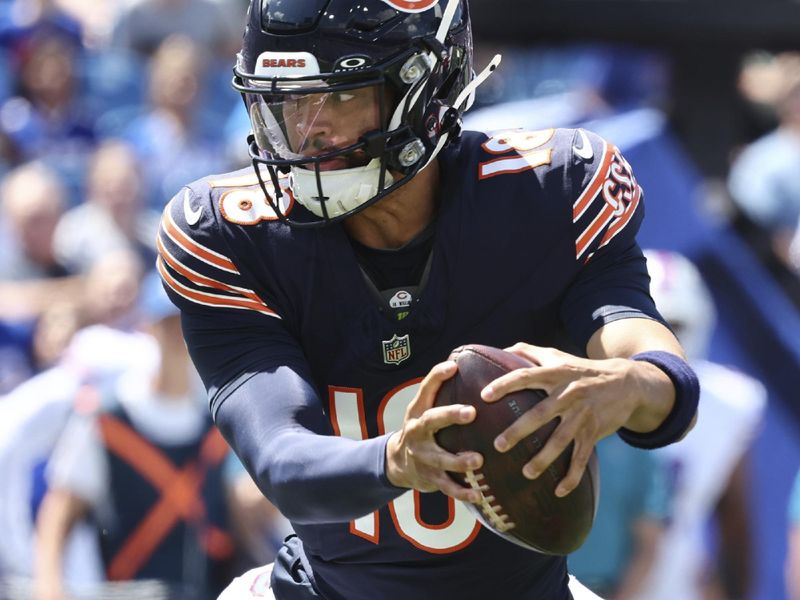 Chicago Bears quarterback Caleb Williams (18) scrambles during the first half of an NFL football pre-season game against the Buffalo Bills in Orchard Park N.Y., Saturday Aug. 10, 2024. (AP Photo/ Jeffrey T. Barnes)