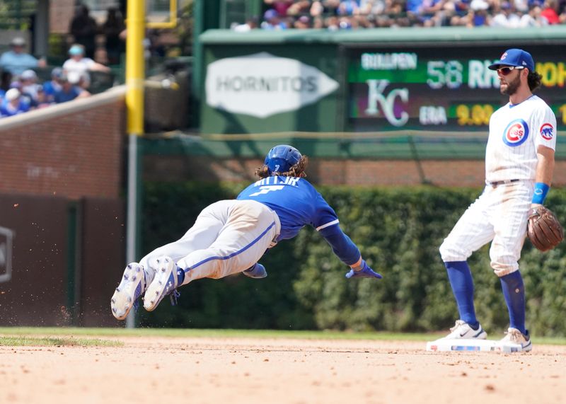 Aug 19, 2023; Chicago, Illinois, USA; Kansas City Royals shortstop Bobby Witt Jr. (7) steals second base as Chicago Cubs shortstop Dansby Swanson (7) stands by the base during the seventh inning at Wrigley Field. Mandatory Credit: David Banks-USA TODAY Sports