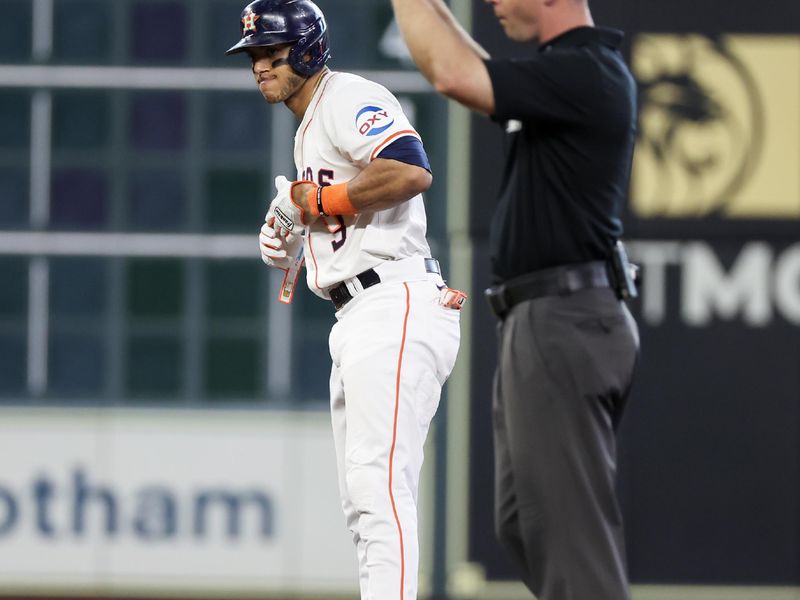 Jun 23, 2024; Houston, Texas, USA;  Houston Astros shortstop Jeremy Pena (3) reacts to his RBI double against the Baltimore Orioles in the first inning at Minute Maid Park. Mandatory Credit: Thomas Shea-USA TODAY Sports