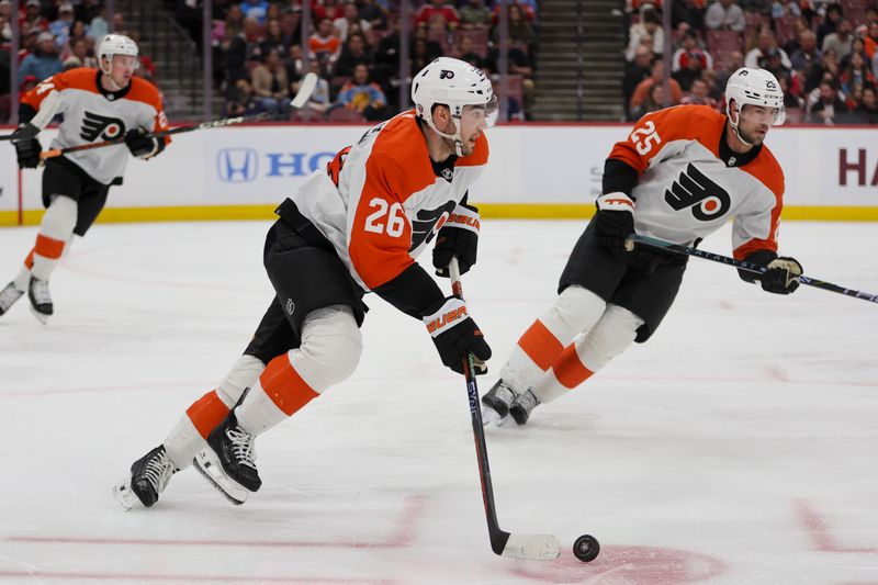 Feb 6, 2024; Sunrise, Florida, USA; Philadelphia Flyers defenseman Sean Walker (26) moves the puck against the Florida Panthers during the second period at Amerant Bank Arena. Mandatory Credit: Sam Navarro-USA TODAY Sports