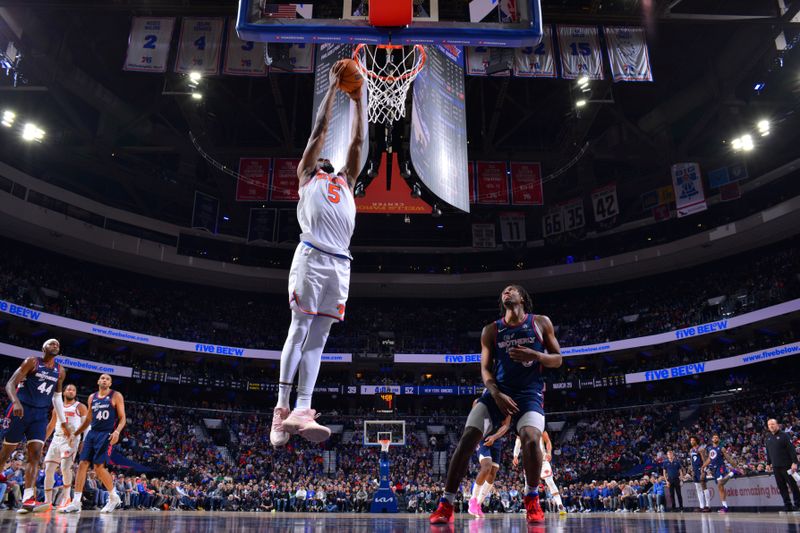 PHILADELPHIA, PA - FEBRUARY 22: Precious Achiuwa #5 of the New York Knicks dunks the ball during the game against the Philadelphia 76ers on February 22, 2024 at the Wells Fargo Center in Philadelphia, Pennsylvania NOTE TO USER: User expressly acknowledges and agrees that, by downloading and/or using this Photograph, user is consenting to the terms and conditions of the Getty Images License Agreement. Mandatory Copyright Notice: Copyright 2024 NBAE (Photo by Jesse D. Garrabrant/NBAE via Getty Images)