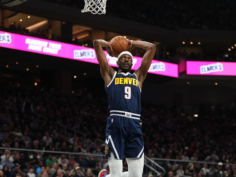 AUSTIN, TX - MARCH 15: Justin Holiday #9 of the Denver Nuggets drives to the basket during the game against the San Antonio Spurs on March 15, 2024 at the Moody Center in Austin, Texas. NOTE TO USER: User expressly acknowledges and agrees that, by downloading and/or using this Photograph, user is consenting to the terms and conditions of the Getty Images License Agreement. Mandatory Copyright Notice: Copyright 2024 NBAE (Photo by Garrett Ellwood/NBAE via Getty Images)