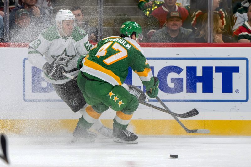 Nov 16, 2024; Saint Paul, Minnesota, USA; Dallas Stars right wing Evgenii Dadonov (63) is checked by Minnesota Wild defenseman Declan Chisholm (47) in the second period at Xcel Energy Center. Mandatory Credit: Matt Blewett-Imagn Images