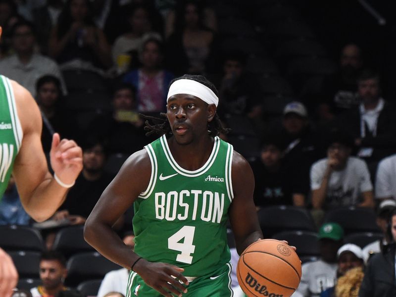 ABU DHABI, UAE - OCTOBER 6: Jrue Holiday #4 of the Boston Celtics dribbles the ball during the game against the Denver Nuggets during the 2024 Global Games on October 6, 2024 at the Etihad Arena in Abu Dhabi, United Arab Emirates. NOTE TO USER: User expressly acknowledges and agrees that, by downloading and/or using this Photograph, user is consenting to the terms and conditions of the Getty Images License Agreement. Mandatory Copyright Notice: Copyright 2024 NBAE (Photo by Brian Babineau/NBAE via Getty Images)