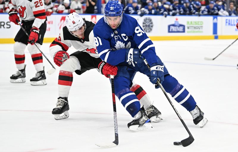 Apr 11, 2024; Toronto, Ontario, CAN; Toronto Maple Leafs forward John Tavares (91) carries the puck past New Jersey Devils defenseman John Marino (6) in the first period at Scotiabank Arena. Mandatory Credit: Dan Hamilton-USA TODAY Sports