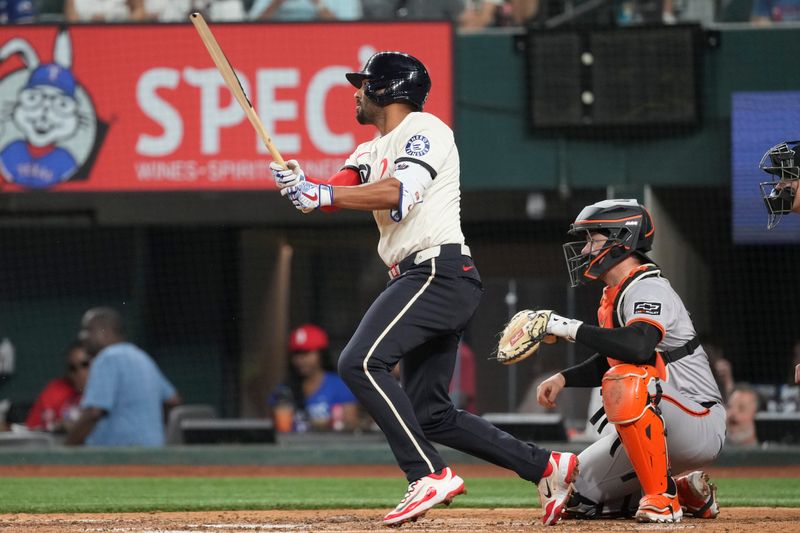 Jun 7, 2024; Arlington, Texas, USA; Texas Rangers second baseman Marcus Semien (2) singles against the San Francisco Giants during the fifth inning at Globe Life Field. Mandatory Credit: Jim Cowsert-USA TODAY Sports