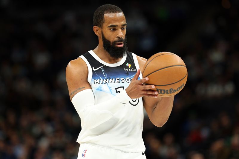 MINNEAPOLIS, MINNESOTA - NOVEMBER 27: Mike Conley #10 of the Minnesota Timberwolves prepares for a free throw against the Sacramento Kings in the second quarter at Target Center on November 27, 2024 in Minneapolis, Minnesota. NOTE TO USER: User expressly acknowledges and agrees that, by downloading and or using this photograph, User is consenting to the terms and conditions of the Getty Images License Agreement. (Photo by David Berding/Getty Images)