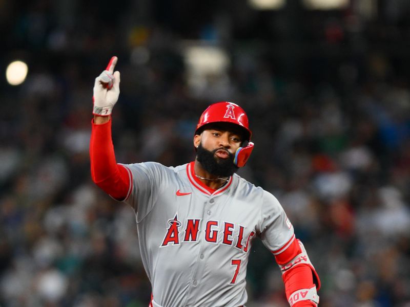 May 31, 2024; Seattle, Washington, USA; Los Angeles Angels pinch hitter Jo Adell (7) celebrates after hitting a grand slam against the Seattle Mariners during the seventh inning at T-Mobile Park. Mandatory Credit: Steven Bisig-USA TODAY Sports