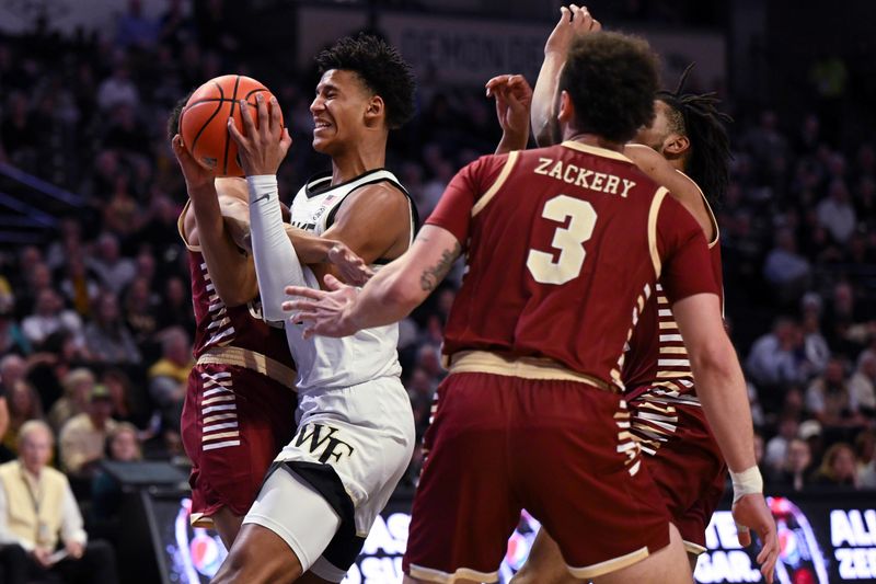 Feb 28, 2023; Winston-Salem, North Carolina, USA; Wake Forest Demon Deacons forward Bobi Klintman (34) is fouled driving to the basket during the first half at Lawrence Joel Veterans Memorial Coliseum. Mandatory Credit: William Howard-USA TODAY Sports