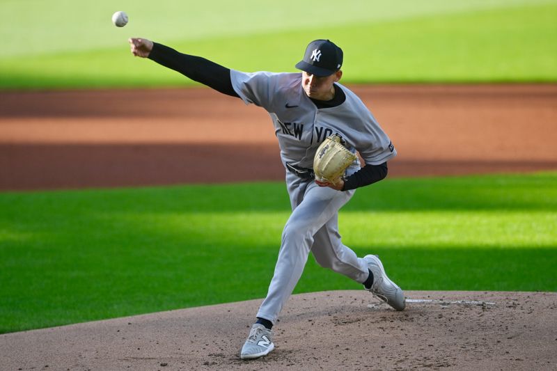Apr 22, 2025; Cleveland, Ohio, USA; New York Yankees starting pitcher Will Warren (98) delivers a pitch in the first inning against the Cleveland Guardians at Progressive Field. Mandatory Credit: David Richard-Imagn Images