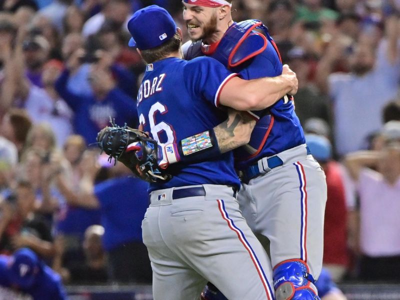 Nov 1, 2023; Phoenix, AZ, USA; Texas Rangers relief pitcher Josh Sborz (66) celebrates with catcher Jonah Heim (28) after defeating the Arizona Diamondbacks to win the World Series in game five of the 2023 World Series at Chase Field. Mandatory Credit: Matt Kartozian-USA TODAY Sports