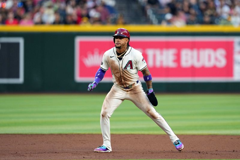 May 3, 2024; Phoenix, Arizona, USA; Arizona Diamondbacks second base Ketel Marte (4) leads off second base against the San Diego Padres during the first inning at Chase Field. Mandatory Credit: Joe Camporeale-USA TODAY Sports