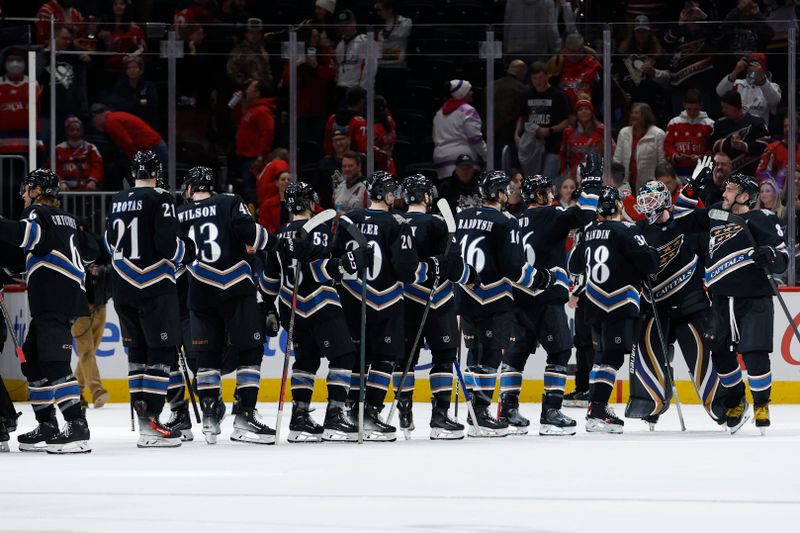 Jan 18, 2025; Washington, District of Columbia, USA; Washington Capitals players celebrate after their game against the Pittsburgh Penguins at Capital One Arena. Mandatory Credit: Geoff Burke-Imagn Images