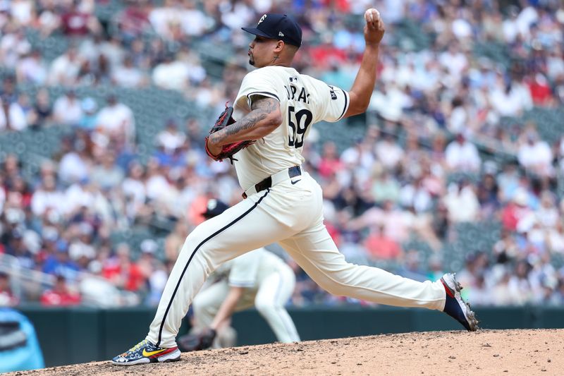 May 25, 2025; Minneapolis, Minnesota, USA; Minnesota Twins pitcher Jhoan Duran (59) delivers a pitch against the Kansas City Royals during the tenth inning at Target Field. Mandatory Credit: Matt Krohn-Imagn Images