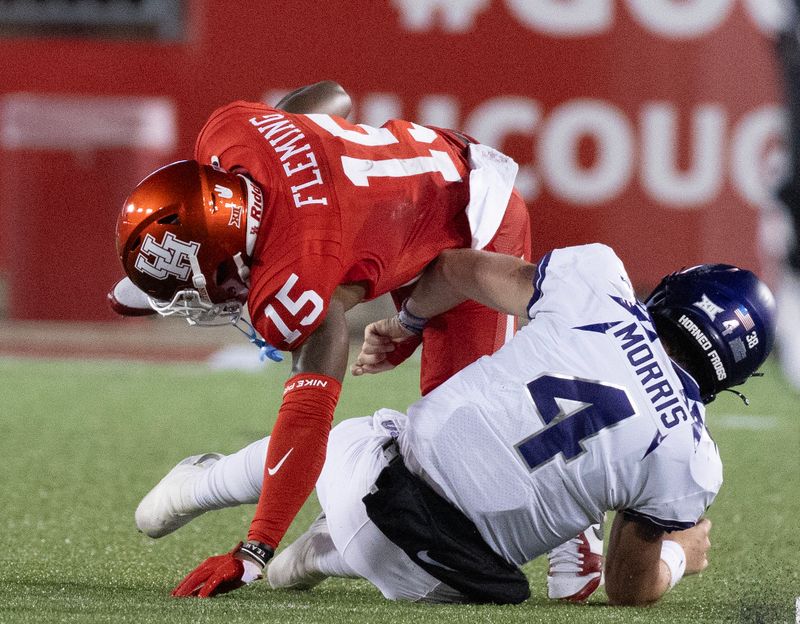 Sep 16, 2023; Houston, Texas, USA ; TCU Horned Frogs quarterback Chandler Morris (4) tackles Houston Cougars defensive back Malik Fleming (15) after he inter opted the ball in the first half at TDECU Stadium. Mandatory Credit: Thomas Shea-USA TODAY Sports