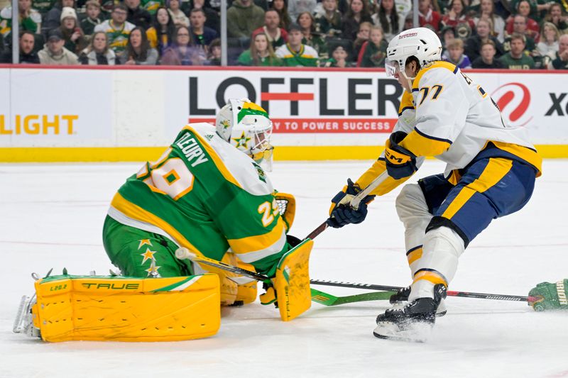 Mar 10, 2024; Saint Paul, Minnesota, USA;  Minnesota Wild goalie Marc-Andre Fleury (29) stops Nashville Predators forward Luke Evangelista (77) on a breakaway during the third period at Xcel Energy Center. Mandatory Credit: Nick Wosika-USA TODAY Sports

