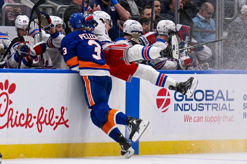 Feb 25, 2025; Elmont, New York, USA;  New York Islanders defenseman Adam Pelech (3) checks New York Rangers defenseman Will Borgen (17) into the boards during the first period at UBS Arena. Mandatory Credit: Dennis Schneidler-Imagn Images