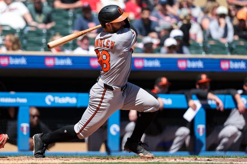 May 8, 2025; Minneapolis, Minnesota, USA; Baltimore Orioles catcher Maverick Handley (98) hits his first career base hit against the Minnesota Twins during the fourth inning at Target Field. Mandatory Credit: Matt Krohn-Imagn Images