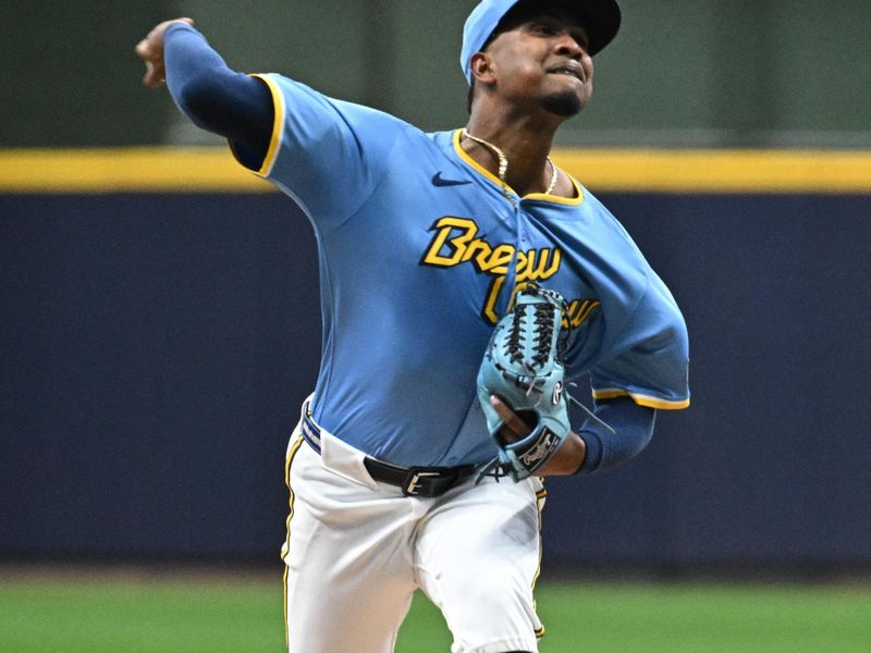 Jun 11, 2024; Milwaukee, Wisconsin, USA; Milwaukee Brewers starting pitcher Carlos Rodriguez (00) delivers a pitch against the Toronto Blue Jays in the first inning at American Family Field. Mandatory Credit: Michael McLoone-USA TODAY Sports