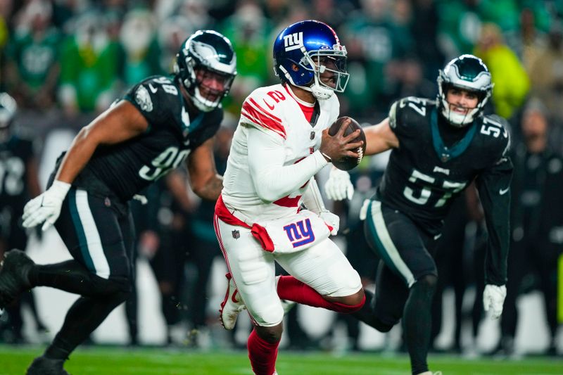 New York Giants quarterback Tyrod Taylor looks to pass against the Philadelphia Eagles during the second half of an NFL football game Monday, Dec. 25, 2023, in Philadelphia. (AP Photo/Matt Rourke)