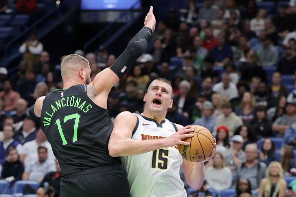 NEW ORLEANS, LOUISIANA - NOVEMBER 17: Nikola Jokic #15 of the Denver Nuggets goes to the basket against Jonas Valanciunas #17 of the New Orleans Pelicans during the first half of an NBA In-Season Tournament game at the Smoothie King Center on November 17, 2023 in New Orleans, Louisiana. NOTE TO USER: User expressly acknowledges and agrees that, by downloading and or using this Photograph, user is consenting to the terms and conditions of the Getty Images License Agreement. (Photo by Jonathan Bachman/Getty Images)