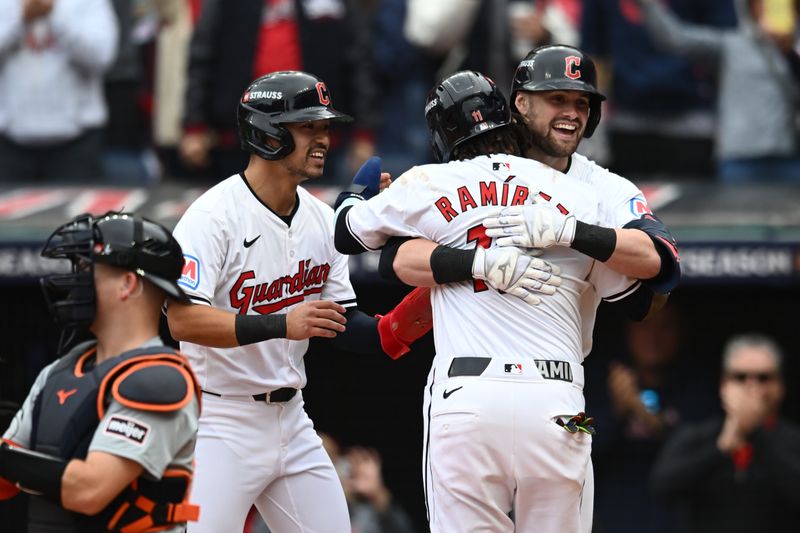 Oct 12, 2024; Cleveland, Ohio, USA; Cleveland Guardians outfielder Lane Thomas (8) celebrates with outfielder Steven Kwan (38) and third base José Ramírez (11)  in the fifth inning against the Detroit Tigers during game five of the ALDS for the 2024 MLB Playoffs at Progressive Field. Mandatory Credit: Ken Blaze-Imagn Images