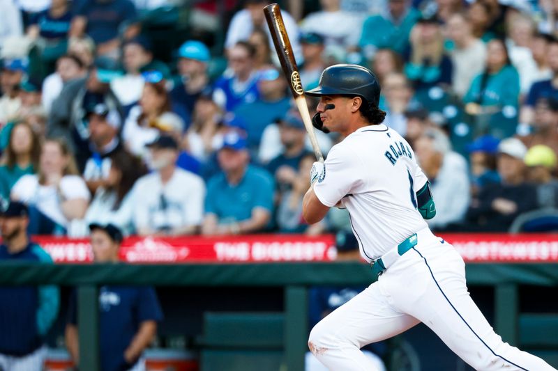 Jul 2, 2024; Seattle, Washington, USA; Seattle Mariners third baseman Josh Rojas (4) hits a single against the Baltimore Orioles during the third inning at T-Mobile Park. Mandatory Credit: Joe Nicholson-USA TODAY Sports