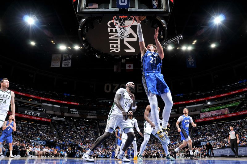 ORLANDO, FL - APRIL 14: Moritz Wagner #21 of the Orlando Magic drives to the basket during the game against the Milwaukee Bucks on April 14, 2024 at Kia Center in Orlando, Florida. NOTE TO USER: User expressly acknowledges and agrees that, by downloading and or using this photograph, User is consenting to the terms and conditions of the Getty Images License Agreement. Mandatory Copyright Notice: Copyright 2024 NBAE (Photo by Fernando Medina/NBAE via Getty Images)