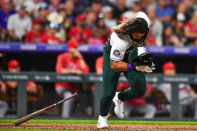 Jun 24, 2023; Denver, Colorado, USA;  Colorado Rockies catcher Jorge Alfaro (38) loses his batting helmet as he grounds out in the fourth inning against the Los Angeles Angelsat Coors Field. Mandatory Credit: John Leyba-USA TODAY Sports