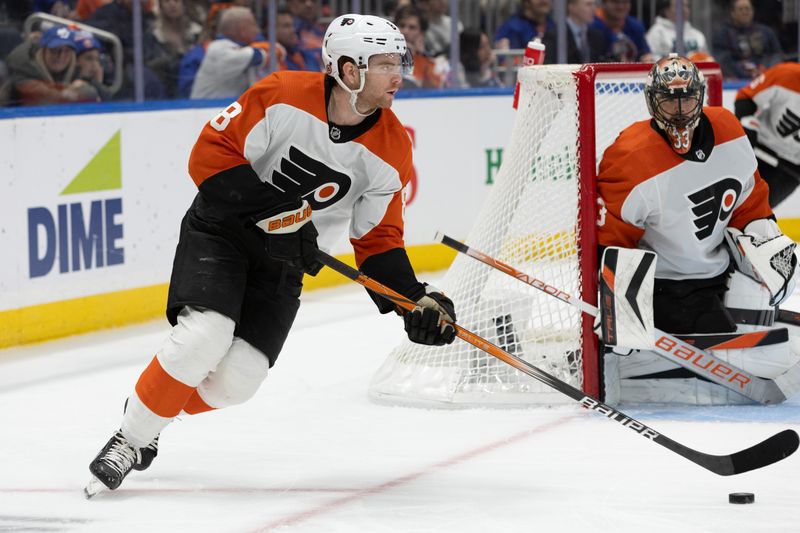 Nov 25, 2023; Elmont, New York, USA; Philadelphia Flyers defenseman Cam York (8) controls the puck against the New York Islanders during the second period at UBS Arena. Mandatory Credit: Thomas Salus-USA TODAY Sports