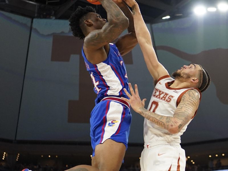 Mar 4, 2023; Austin, Texas, USA; Kansas Jayhawks forward KJ Adams Jr. (24) shoots over Texas Longhorns forward Timmy Allen (0) during the second half at Moody Center. Mandatory Credit: Scott Wachter-USA TODAY Sports