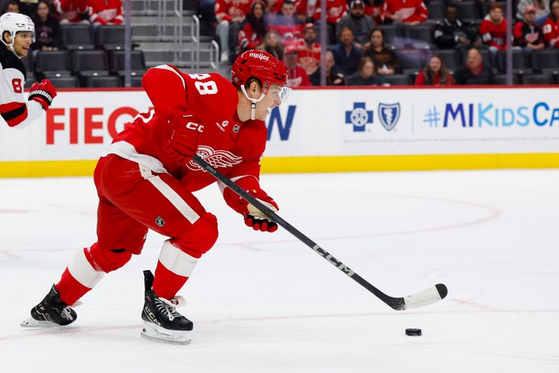 Oct 24, 2024; Detroit, Michigan, USA;  Detroit Red Wings right wing Jonatan Berggren (48) skates with the puck in the first period against the New Jersey Devils at Little Caesars Arena. Mandatory Credit: Rick Osentoski-Imagn Images