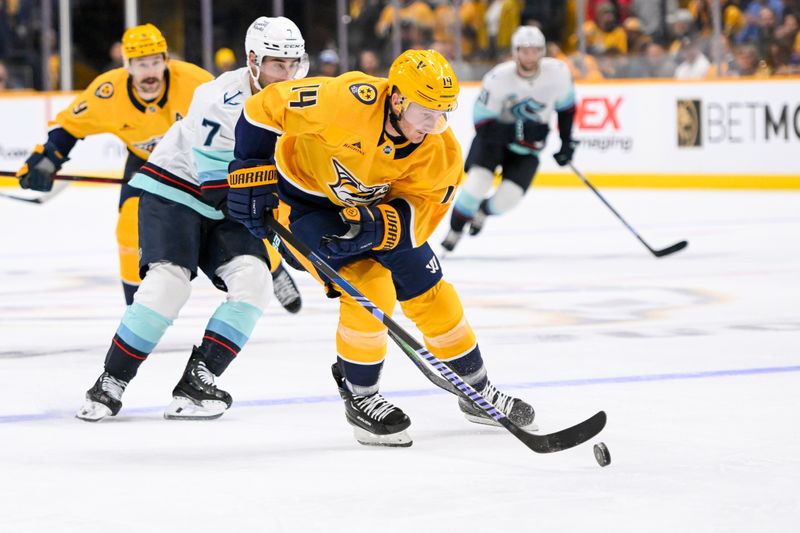 Oct 15, 2024; Nashville, Tennessee, USA;  Nashville Predators center Gustav Nyquist (14) skates against the Seattle Kraken during the first period at Bridgestone Arena. Mandatory Credit: Steve Roberts-Imagn Images