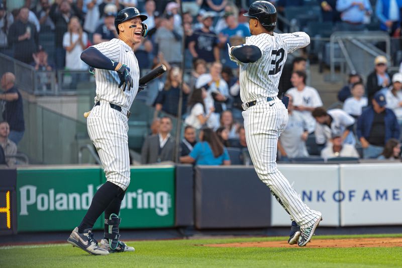 Aug 20, 2024; Bronx, New York, USA; New York Yankees right fielder Juan Soto (22) celebrates with center fielder Aaron Judge (99) after hitting a solo home run during the first inning against the Cleveland Guardians at Yankee Stadium. Mandatory Credit: Vincent Carchietta-USA TODAY Sports