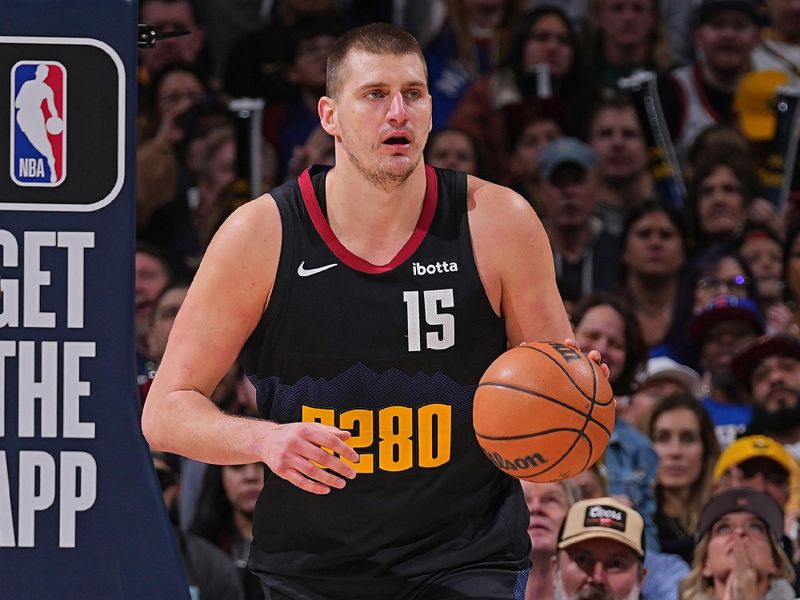 DENVER, CO - JANUARY 27: Nikola Jokic #15 of the Denver Nuggets brings the ball up court during the game against the Philadelphia 76ers on January 27, 2024 at the Ball Arena in Denver, Colorado. NOTE TO USER: User expressly acknowledges and agrees that, by downloading and/or using this Photograph, user is consenting to the terms and conditions of the Getty Images License Agreement. Mandatory Copyright Notice: Copyright 2024 NBAE (Photo by Bart Young/NBAE via Getty Images)